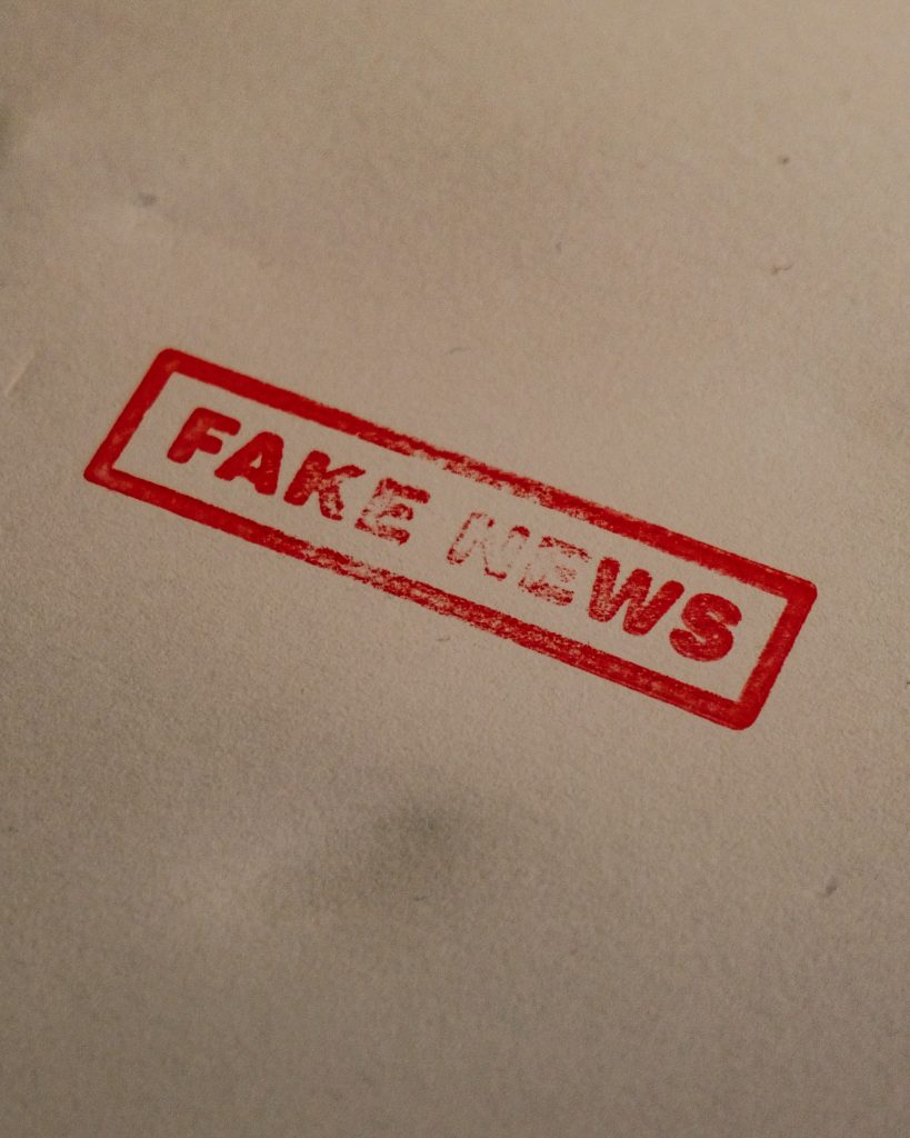 "Fake news" stamped on paper